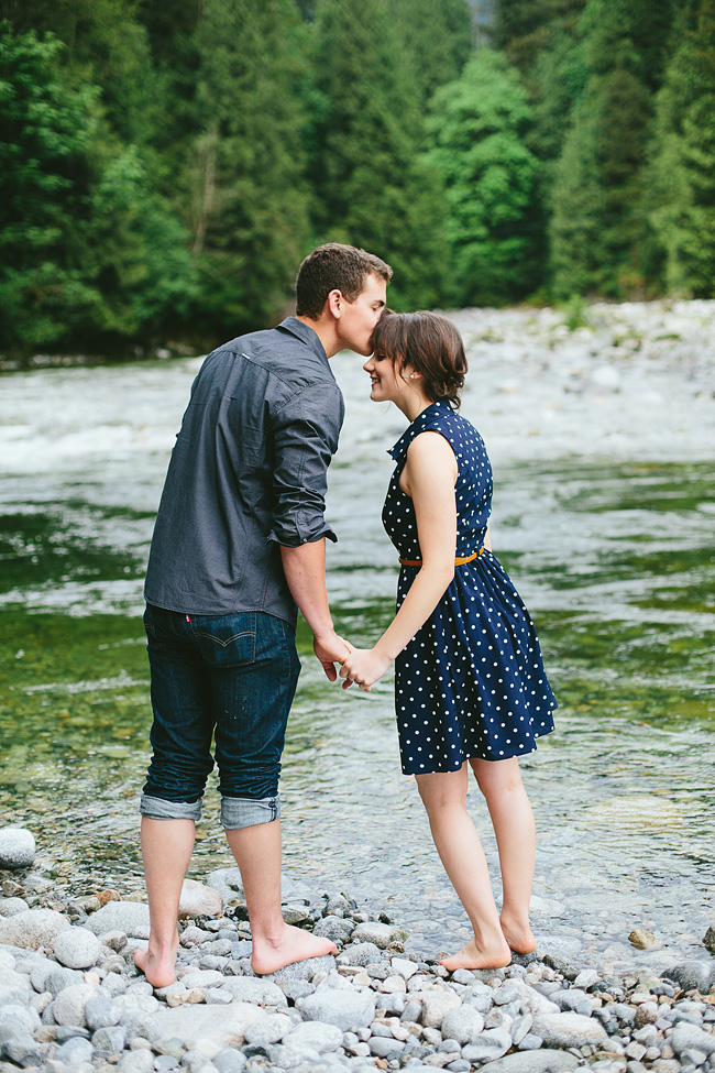 kissing in the river engagement photos
