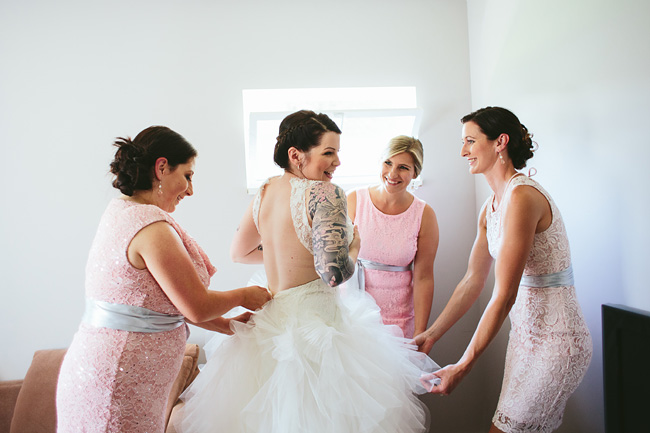 Bride getting into dress